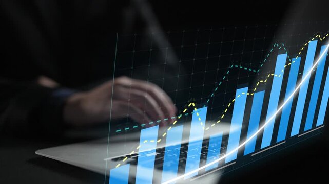 A professional setting showcasing a laptop displaying dynamic growth charts and financial data trends, emphasizing analytics and modern business strategy insights. Copula