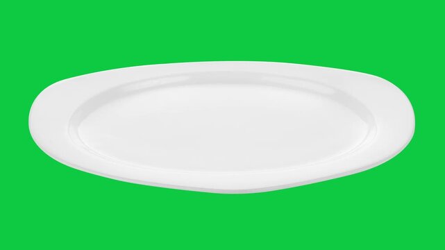 Empty plate isolated on green screen