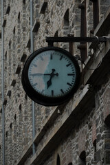 Fototapeta premium “Outdoor Wall Clock on Historic Stone Building