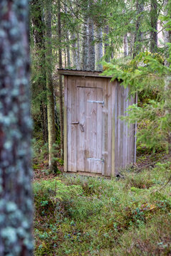 Small outhouse in the middle of a forest in Sweden