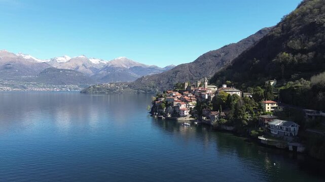 High view of Como Lake and detail of Corenno Plinio, from drone, during sunny day of Easter