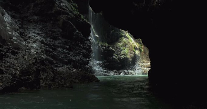 Low Drone Shot of River Bend Flowing Through Tropical Jungle Canyon
