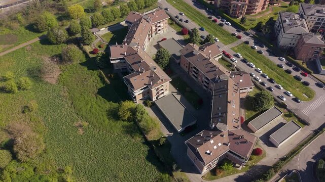 Urban Aerial View: An elevated view showcases a modern architectural ensemble amidst an urban landscape, blending seamlessly with its surroundings.