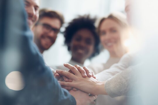 successful diverse team collaborating together in positive work environment