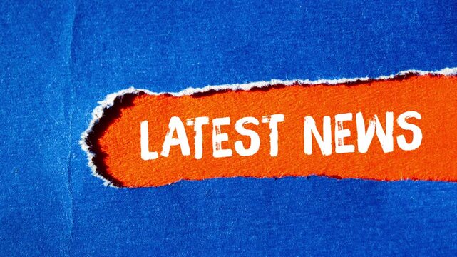 Latest news message writing on ripped torn paper background