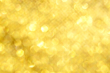 Obraz premium Golden bokeh background with glitter sparkle for festive holiday and luxury design