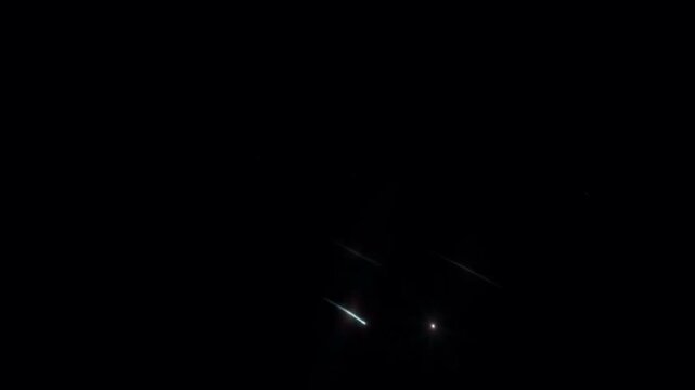 Realistic white meteor shower on black background.