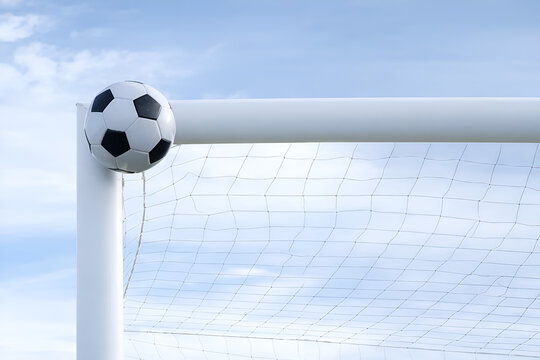 Soccer Ball Hitting Goal Post Crossbar with Sky Background
