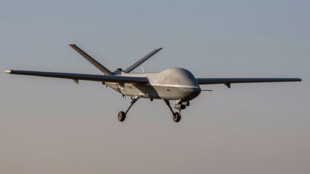Unmanned aerial vehicle uav mid-flight against clear hazy sky large military-grade drone sleek angular design