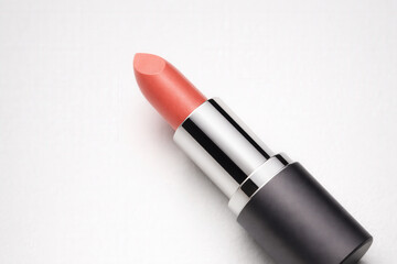Fototapeta premium Coral Lipstick Tube on Clean White Background