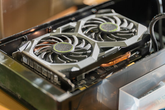 Close up of a dusty graphics card in a black container