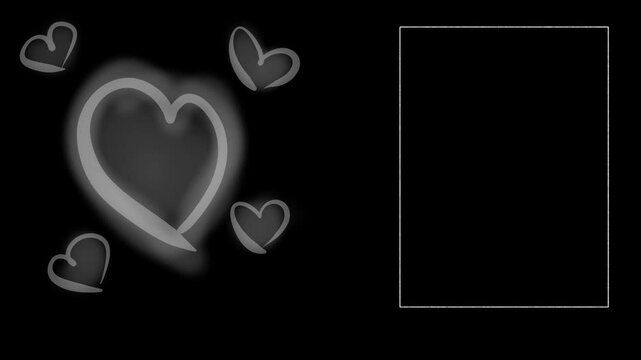 There's a frame and hearts on a black background. The hearts grow larger, simulating a heartbeat or pulse.