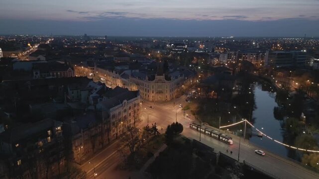 Timisoara city centre with Bega River bridge and Saint Maria district on March 24, 2026, showing urban scenery, flowing water, and everyday life in a European city.