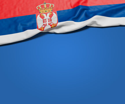 The wrinkled flag of Serbia draped onto a flat blue background with shadow. Copy space for message