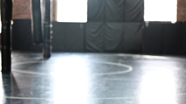 bokeh off focus background video of martial arts gym, mma jiujitsu kickboxing, self improvement