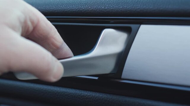 Person opening modern car door from inside