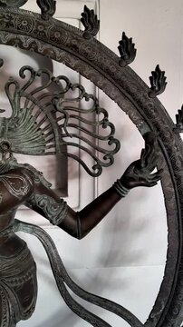 Zoom out shot of Nataraja Lord Shiva bronze statue, Tandava dance posture