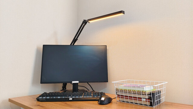 White wire basket with glass jar and napkin on shelf. Home organization and storage solution. Modern interior decor for bathroom or bedroom. Minimalist lifestyle accessory, tidy space.
