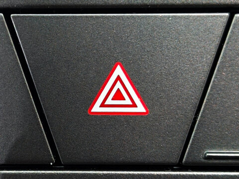 Red Emergency Hazard Warning Flasher Button on Car Dashboard