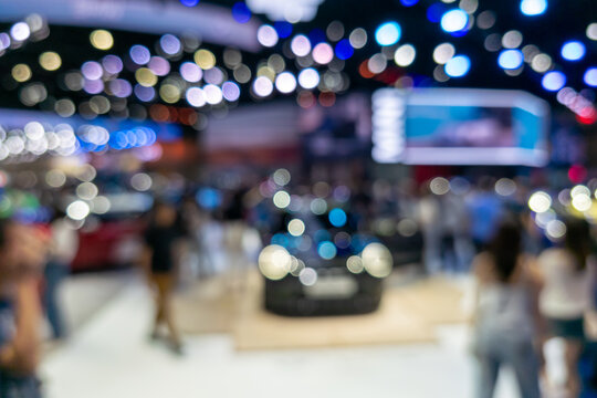Blurred Background of Luxury Car Exhibition with Vibrant Bokeh