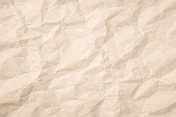 Obraz premium A close up view showcases a heavily crumpled piece of tan colored paper displaying a complex network of folds and wrinkles throughout its surface