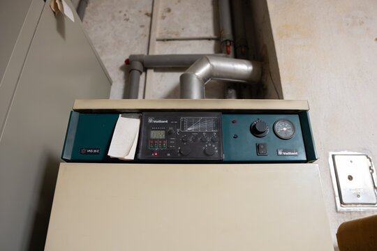 DRESDEN, GERMANY - 3. April 2026: Vaillant VKS 35 E gas boiler close-up. Old heating in the basement of a building. Outdated technology in a residential house.