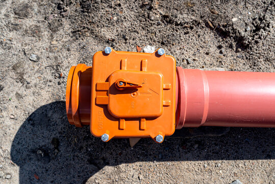 Septic tank connection with storm valve on pvc pipe
