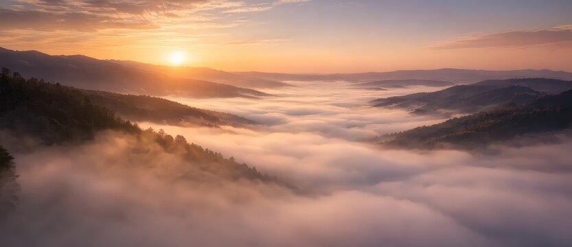 Minimal cinematic landscape of a foggy valley at sunrise, with soft golden light and layered mountains creating a calm atmosphere and large copy space for commercial use 05