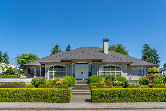 Two story luxury house with beautiful summer  landscape in Vancouver, Canada, North America. Day time on August 2025.