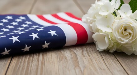 Obraz premium Folded american flag and white hydrangea flowers on rustic wooden background