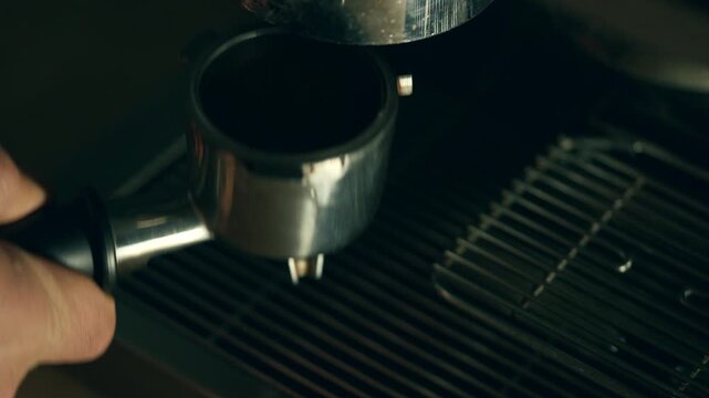 Inserting a portafilter into an espresso machine