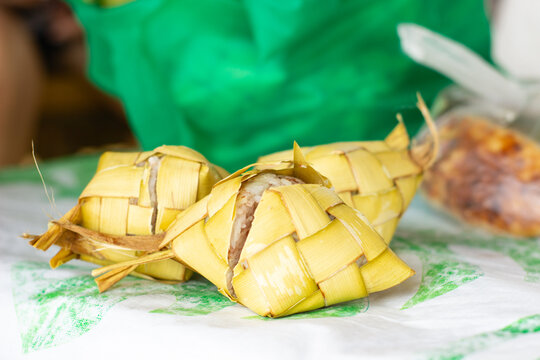 Freshly cooked Filipino puso rice, wrapped in coconut leaves. Puso, or hanging rice, is a traditional Filipino delicacy from Cebu and the Visayas region