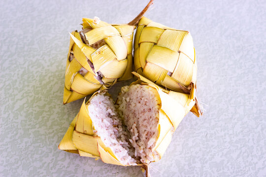 Freshly cooked Filipino puso rice, wrapped in coconut leaves. Puso, or hanging rice, is a traditional Filipino delicacy from Cebu and the Visayas region