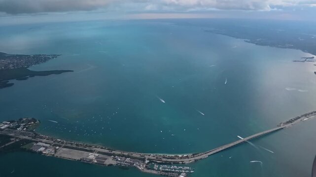 Aerial Gateway: 4K Airplane POV Flying Over the Rickenbacker Causeway Bridge and Biscayne Bay, Miami