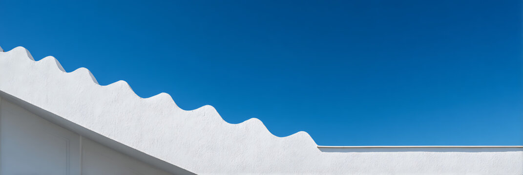 Minimalist architectural detail featuring a white wavy roofline against a vibrant clear blue sky perfect for modern design concepts and clean backgrounds