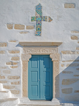Close-Up of Wooden Church Door with Mosaic Cross at Church of Agios Konstantinos, Paros, Greece