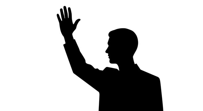 Silhouette of a man raising his hand in a gesture of greeting or asking a question 1.