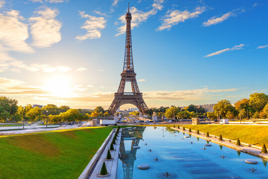 Famous Eiffel Tower view with sunset Trocadero Gardens Fountain reflection, Paris, France