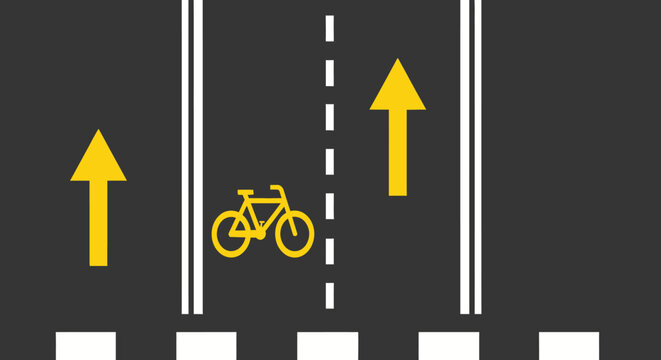 Top view of a dedicated bicycle lane with an upward arrow on a dark asphalt road.