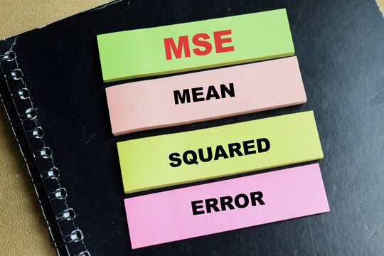 Concept of MSE - Mean Squared Error write on sticky notes isolated on Wooden Table. For data science, statistics and mathematical accuracy