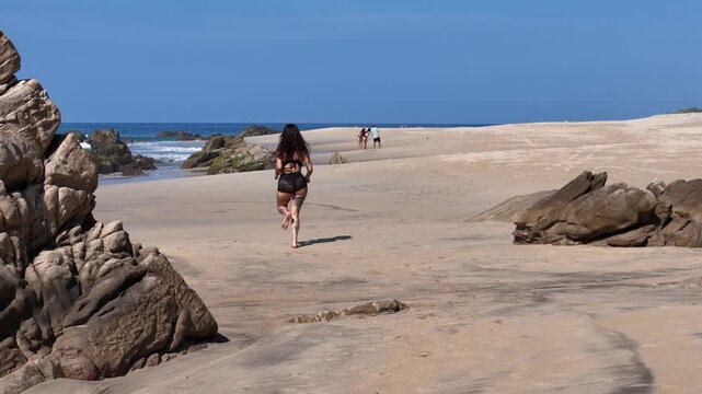 woman running on the beach