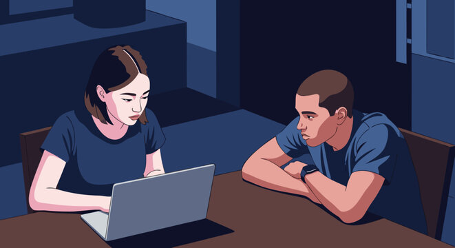 Two people using a laptop computer together at a table in a dimly lit room, focusing on digital collaboration