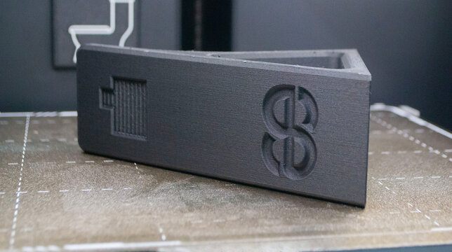 3D printed art object. Object printed on 3D printer from melted black plastic. Model created on 3D printer from threads of molten plastic inside 3D printer. Modern additive progressive technologies