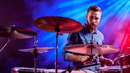 Obraz premium Drummer playing drums during live concert performance