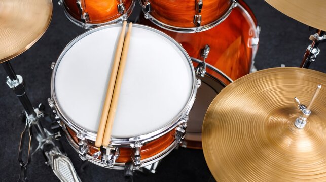 Drum kit with snare drum and drumsticks ready for playing