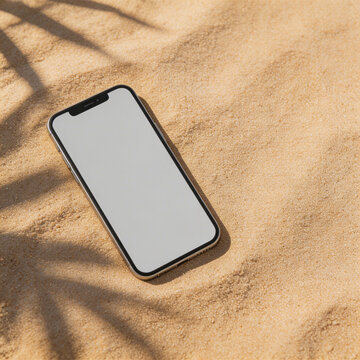 Minimalist smartphone mockup placed on textured beach sand, featuring a blank screen with no content