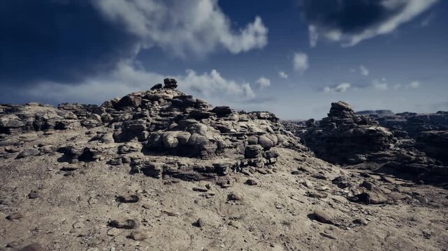 textured rocky foreground leading to outcrops, close ground detail with layered stones, depth perspective and crisp contrast for editorial layouts