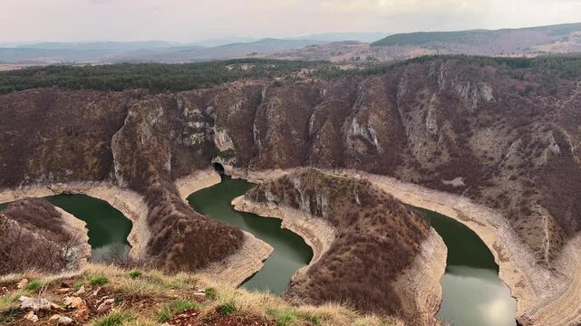 Man looking at Uvac River canyon Serbia scenic viewpoint travel destination