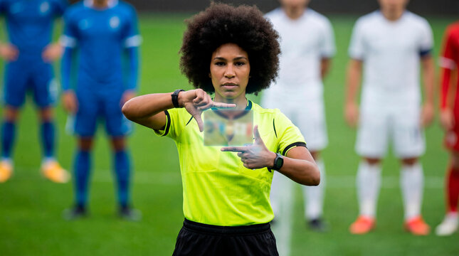 Decisive referee signaling VAR review during competitive match
