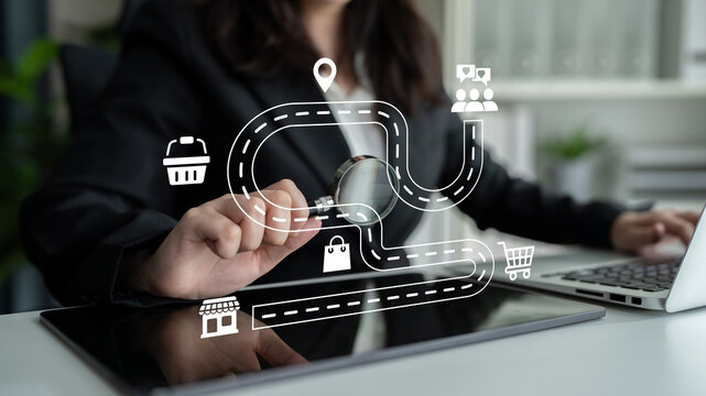 A business professional analyzes innovative solutions to improve customer journeys using digital maps, showcasing growth strategies and modern tools in a sleek office environment. Ledger
